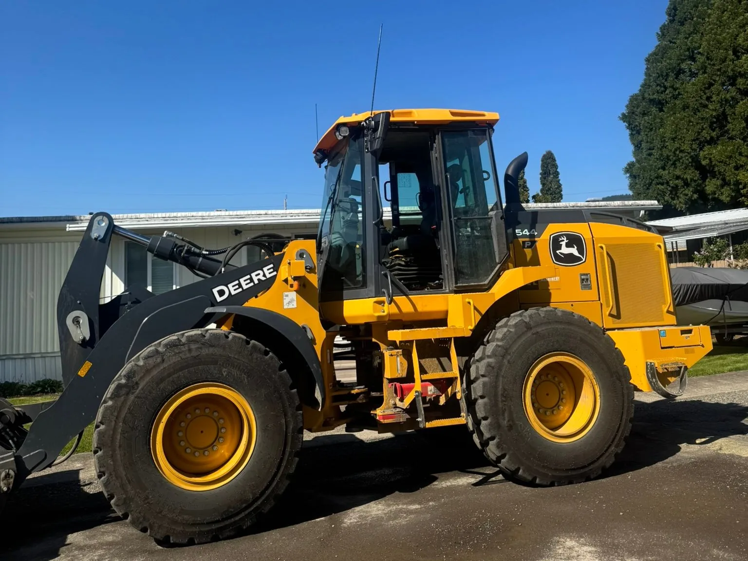 Wheel loader on a paved work area, grading earthwork